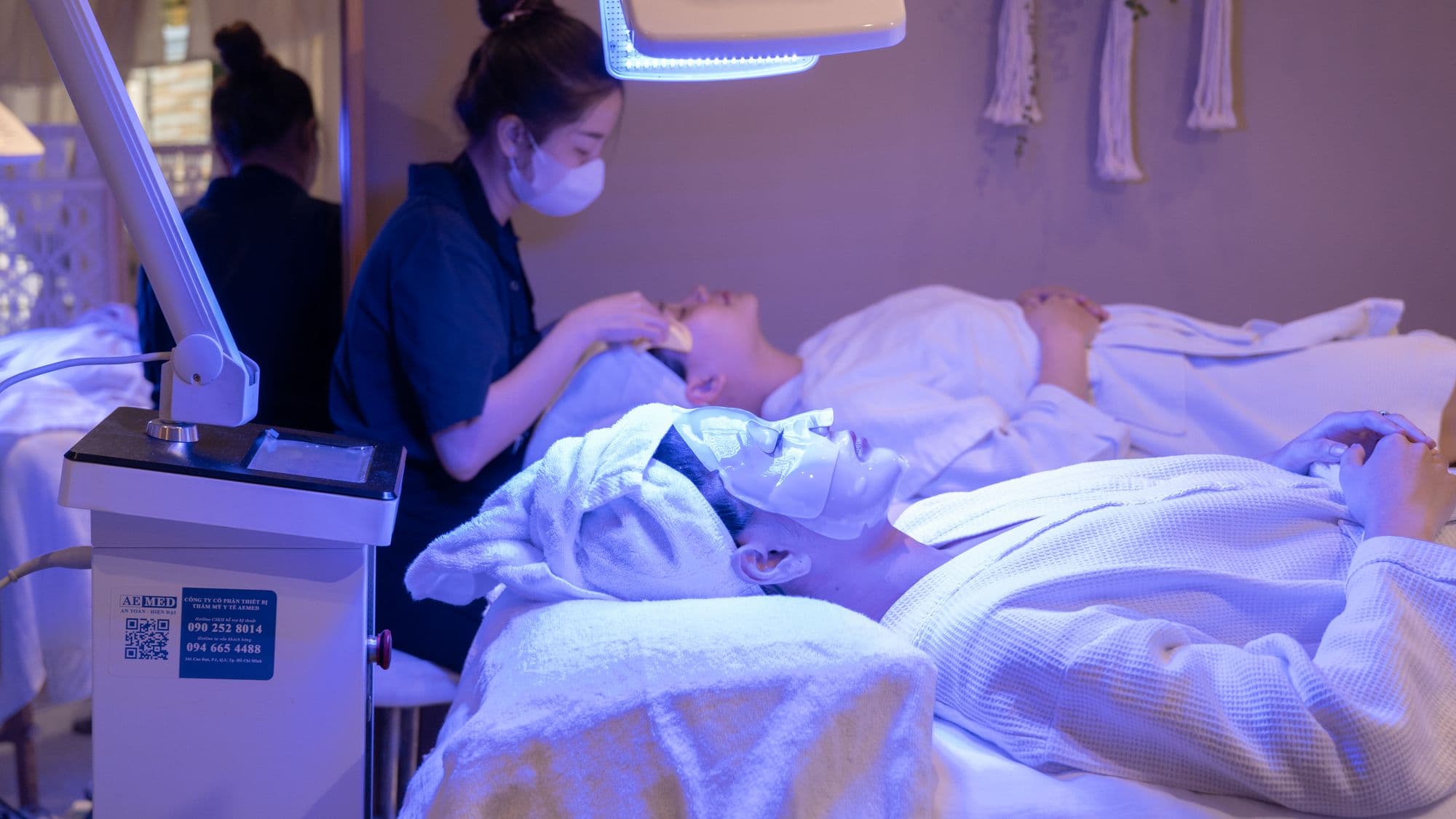 Patients receiving light therapy treatments in a clinic setting